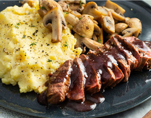 Hertenbiefstuk met champignons en wildjus | Naar recept